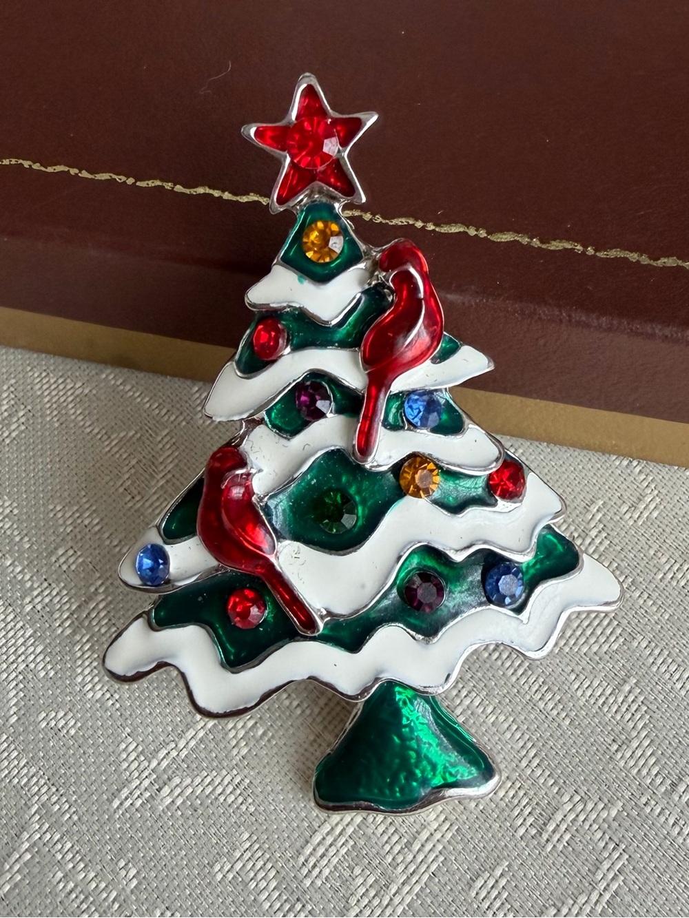 Festive Green and White Christmas Tree Brooch with Red Accents